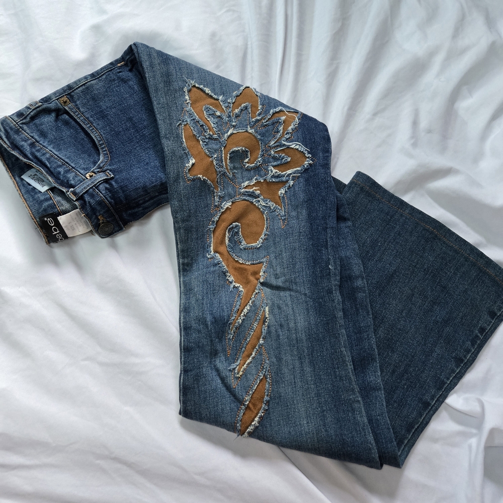 bebe Rio Y2K Lace Up Stonewashed Floral Pattern Tall Boot Cut Blue Jeans